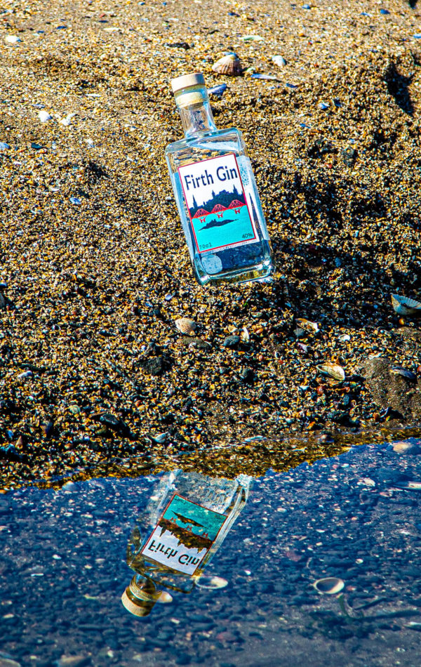 Firth Gin bottle with reflection in water